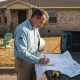 Texas engineer reviews blueprints for home expansion