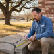 Engineer examining cracked Texas home foundation